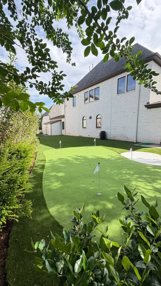 Premium synthetic grass installation with paver accents Houston TX