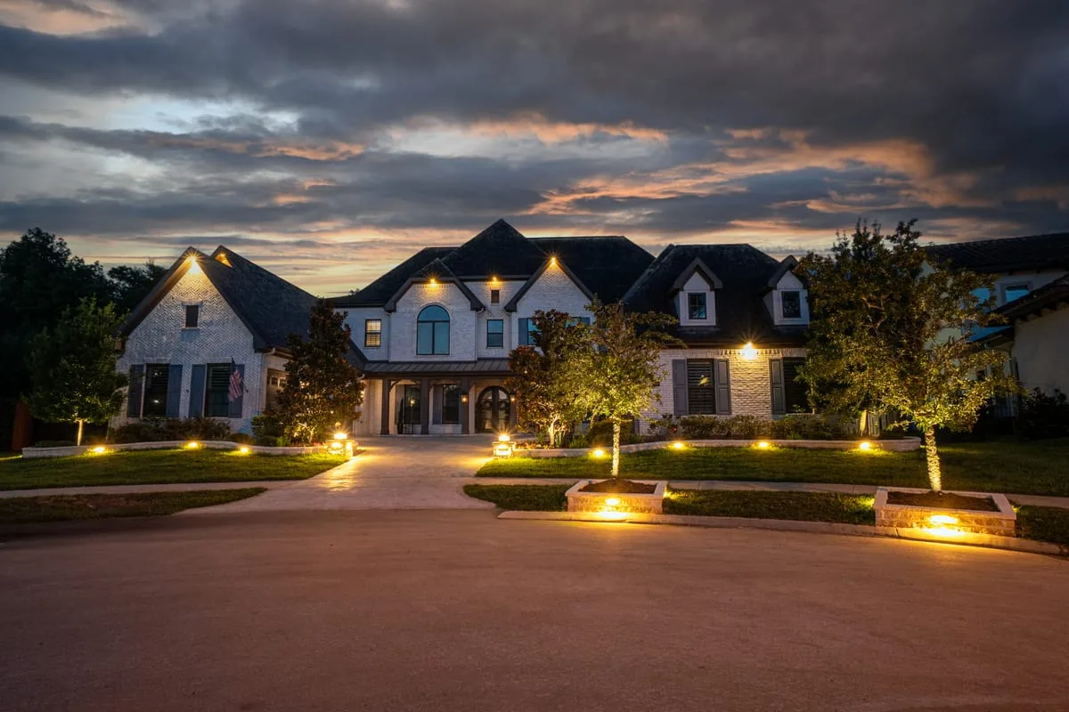 luxury concrete driveway with landscape lighting in Houston TX
