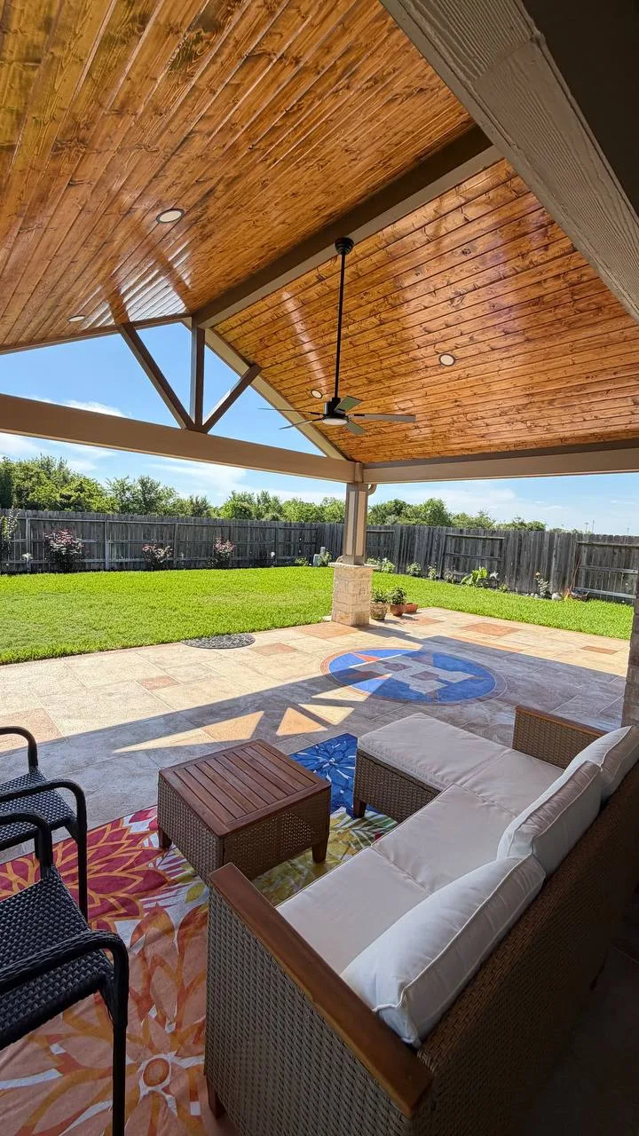 covered patio interior view with stamped concrete wood ceiling and ceiling fan in Houston TX