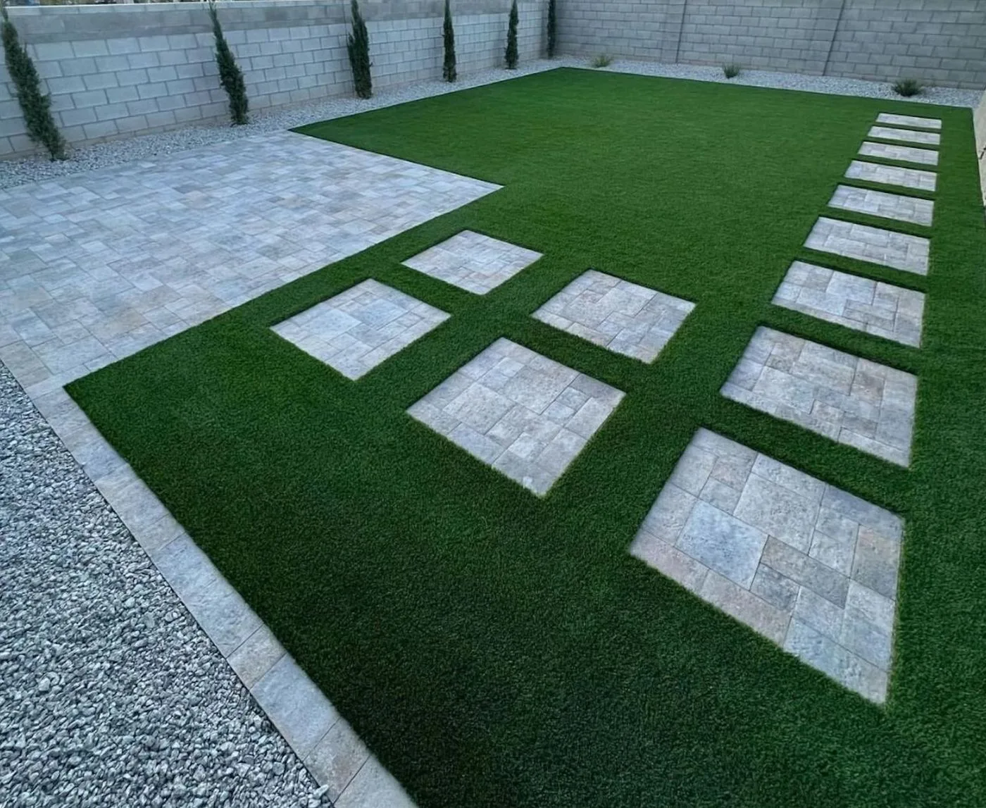 Geometric artificial turf pattern with concrete borders in Houston TX