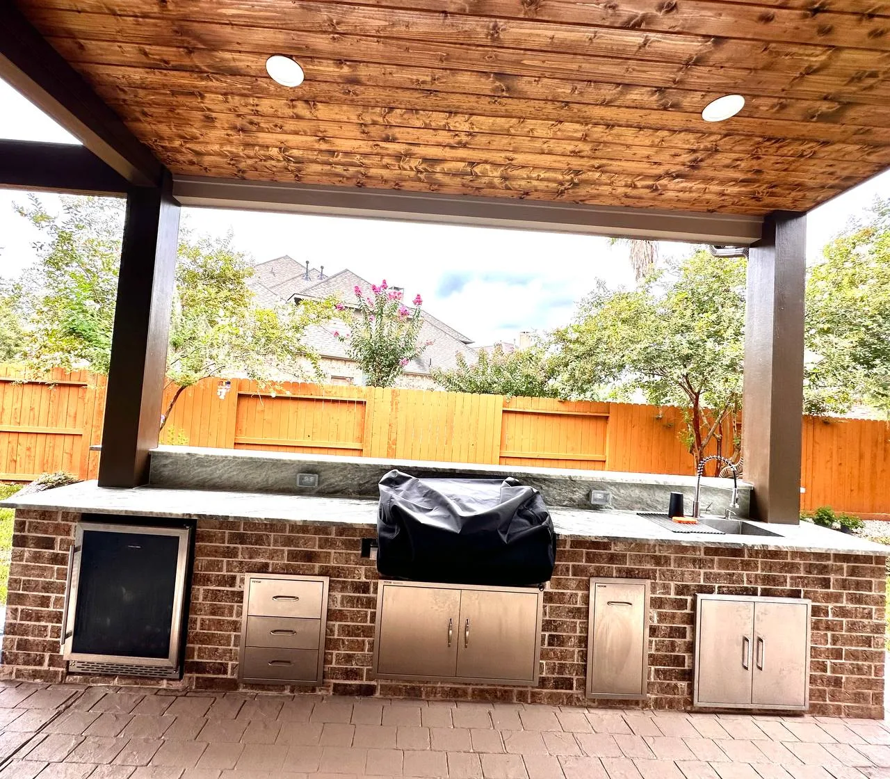 Complete outdoor kitchen island with stone finish in Houston TX
