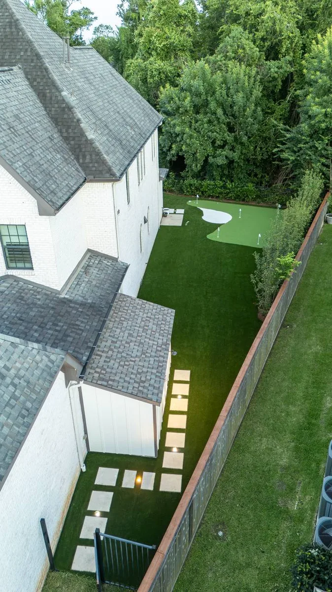 Luxury outdoor living space with pool patio and landscaping Houston TX