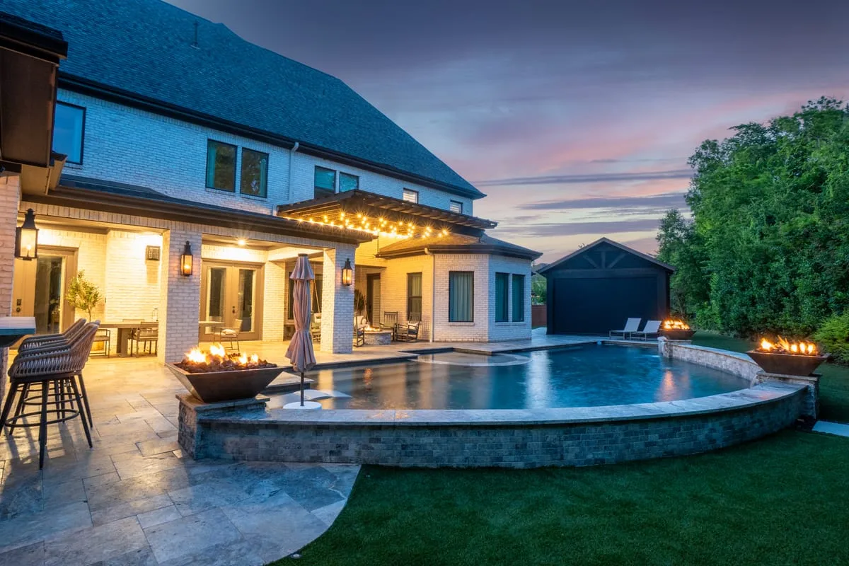 Pool deck with travertine and fire pit in Houston TX