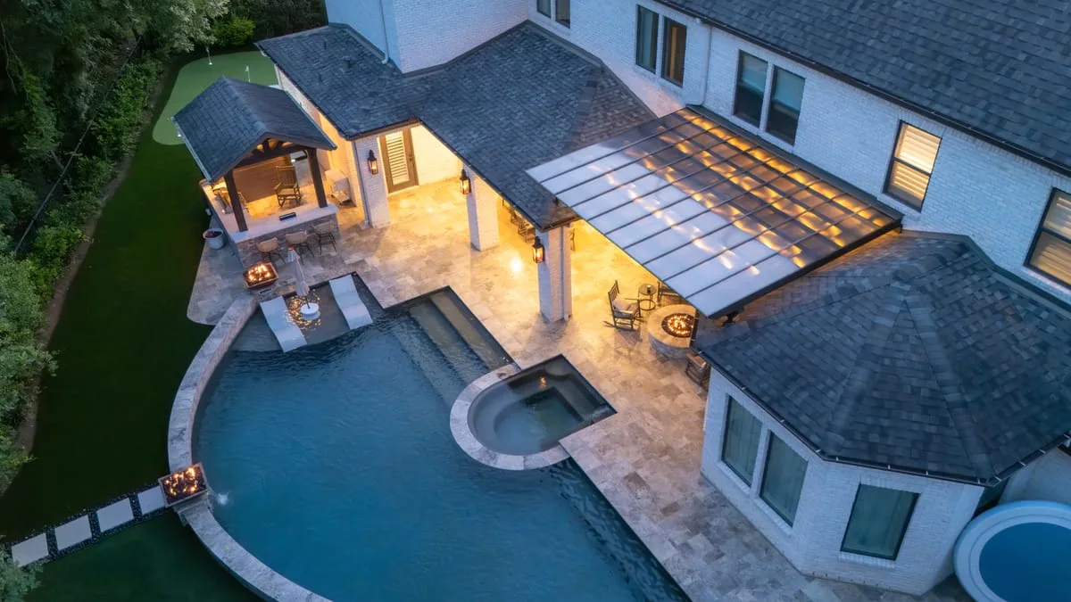 Aerial view of luxury backyard with patio cover pool and spa in Houston TX