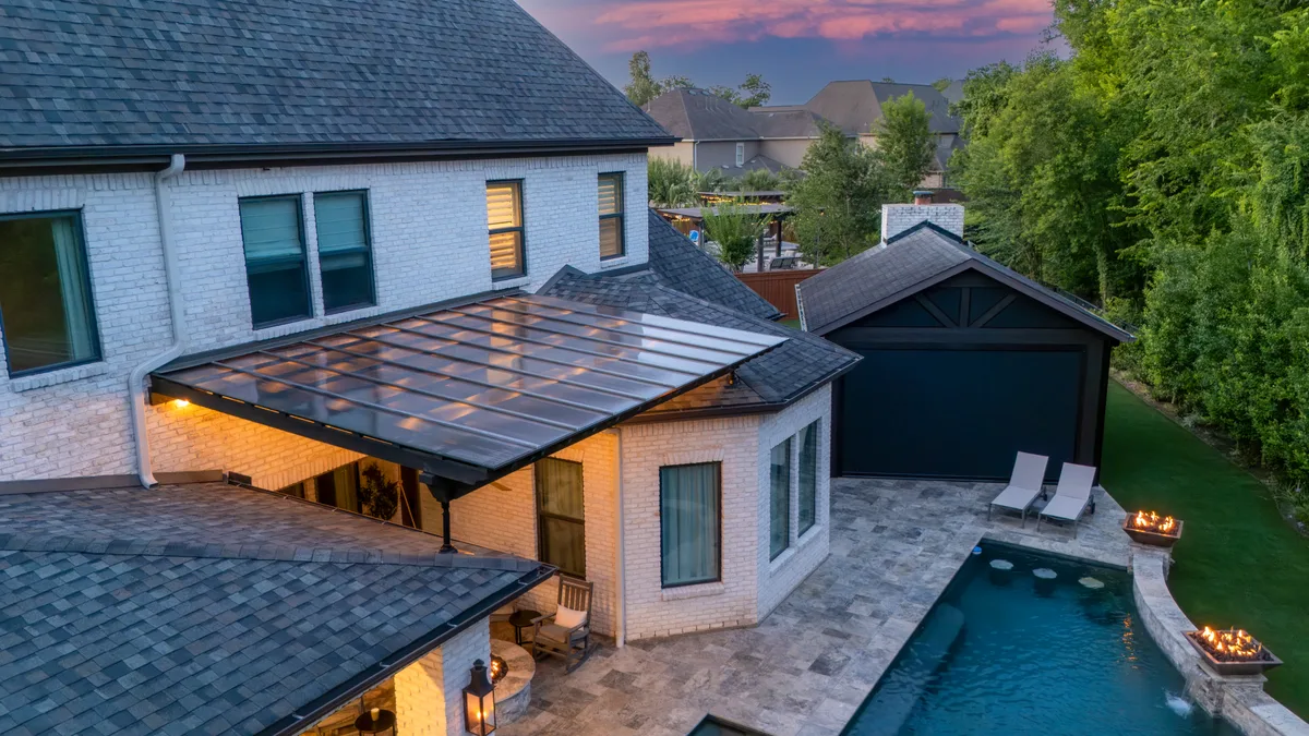 Aerial drone view of backyard pergola and outdoor living space in Houston TX