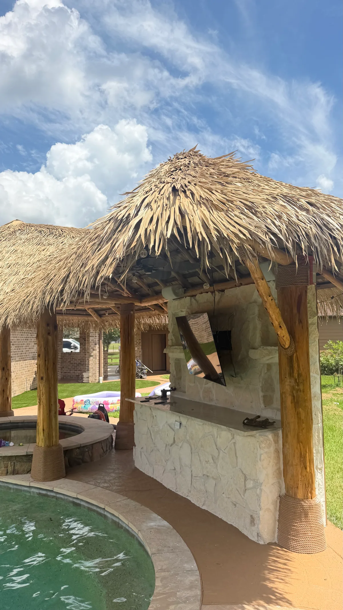 Custom backyard pergola with outdoor seating area in Houston TX
