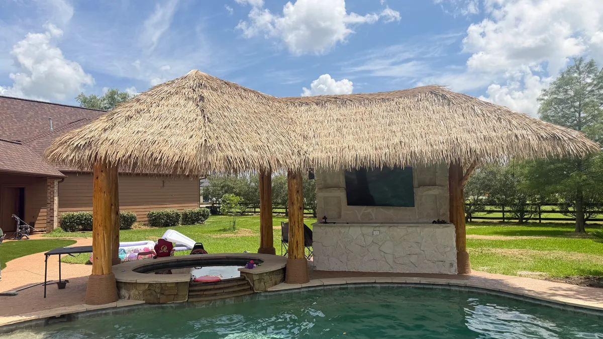 Pergola with shade structure and patio furniture in Houston TX