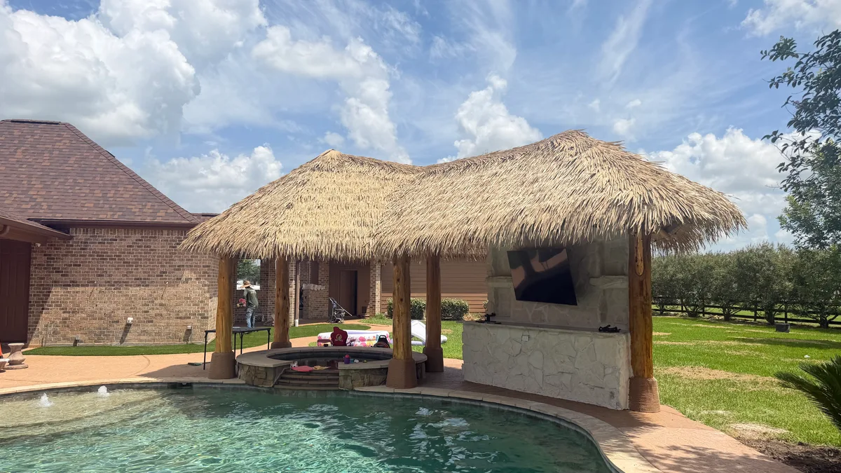 Pergola with outdoor seating area and landscaping in Houston TX