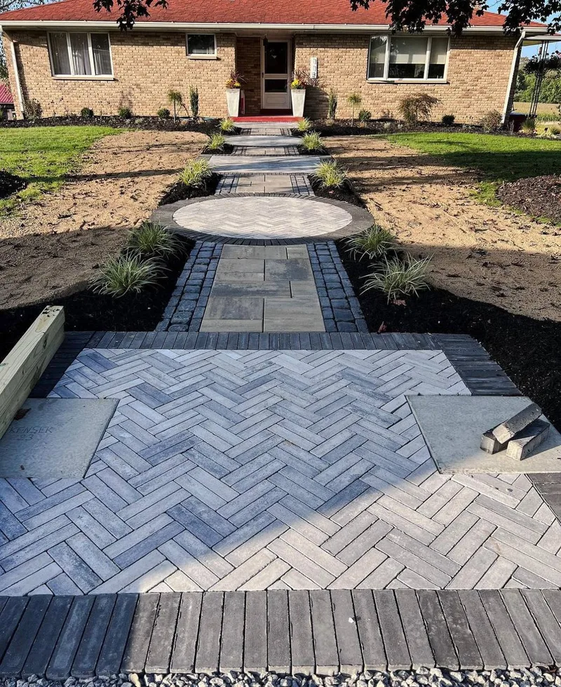 Herringbone paver walkway with circular medallion at front entry in Rosenberg TX