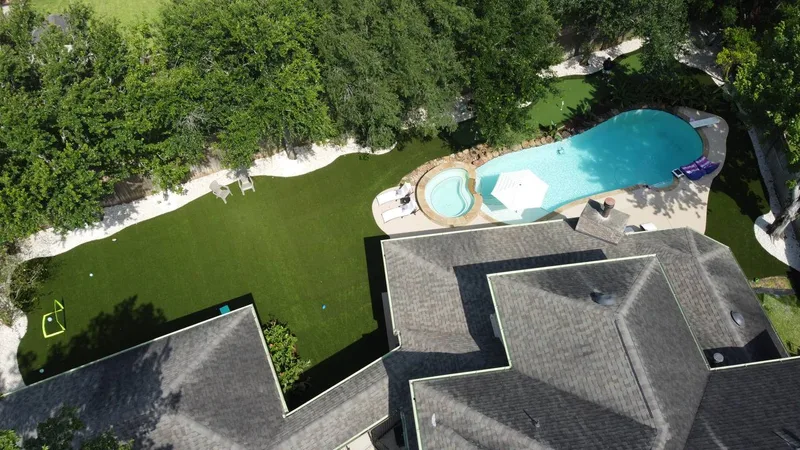 artificial turf synthetic grass installation in Houston TX backyard